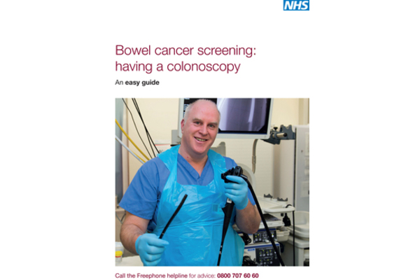 This is the front cover of the 'Bowel cancer screening: having a colonoscopy An easy guide' leaflet. A medical staff (a colonoscopist) holds a colonoscopy tube in his hands. He wears an apron and gloves. Call the Freephone helpline for advice: 0800 707 60 60