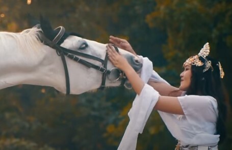 Sarah Saputri and white horse - clip from video.