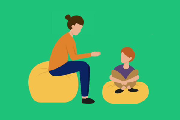 woman on beanbag talking to a child
