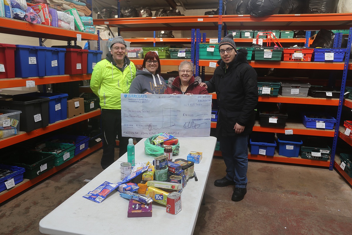 Volunteers receive latest cheque donation of £4,000 from Community Cards. Volunteers receive latest cheque donation of £4,000 from Community Cards.