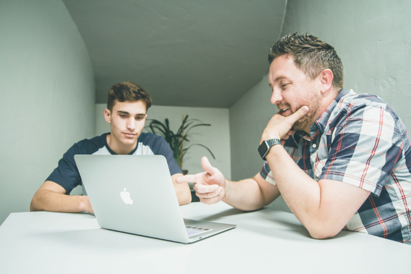 Two men at a laptop