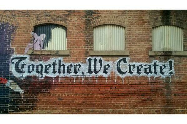Graffitti saying Together We Create